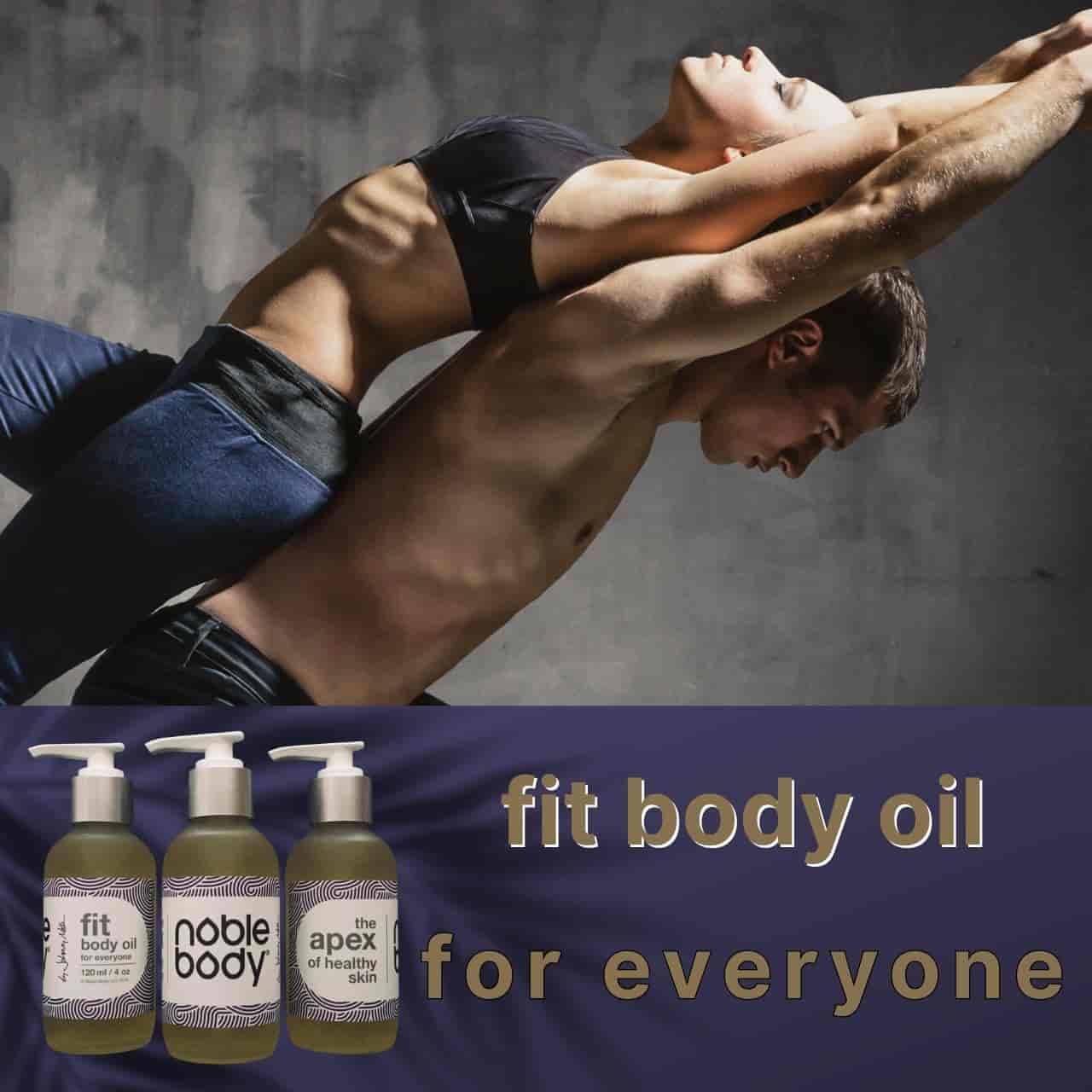 a man doing a handstand with a bottle of body oil in front of him and another bottle of body lotion in front of him